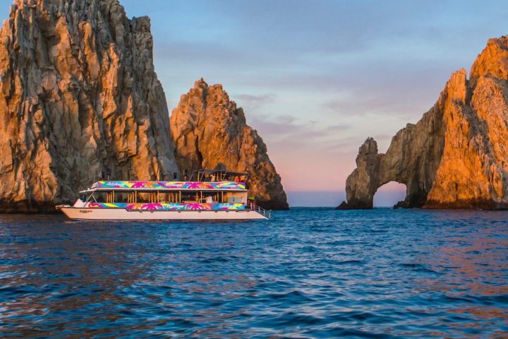 a large body of water with a mountain in the background