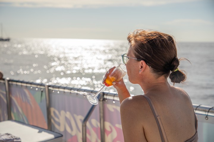 a person standing in front of a body of water