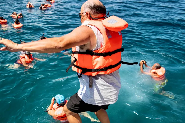 a group of people swimming in a body of water
