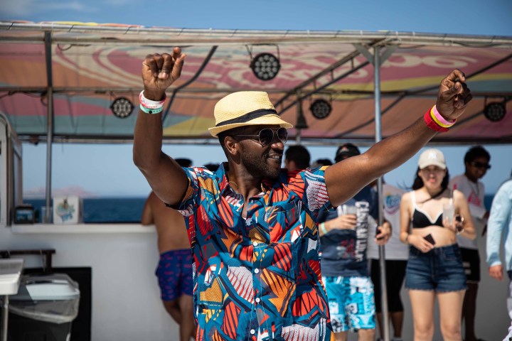 a group of people standing next to a person