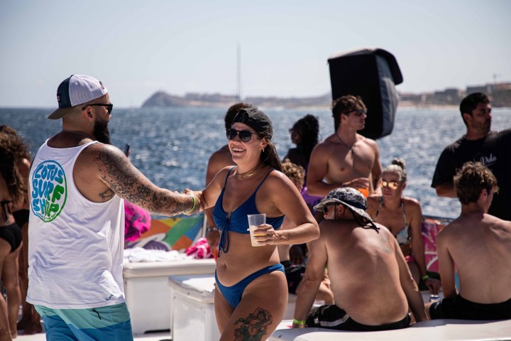 a couple of people that are standing in the water