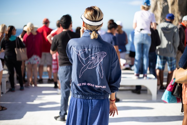 a group of people walking down the street