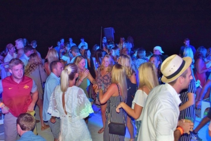 a group of people standing in front of a crowd