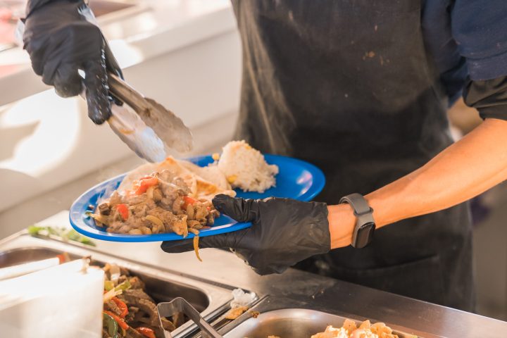 a person preparing food in a pan